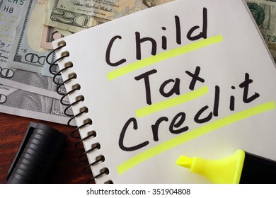 Notebook With  Child Tax Credit Sign On A Table. Business Concept.
