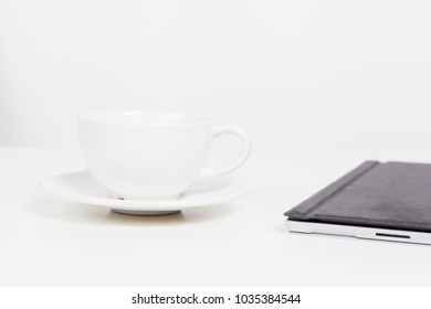 Notebook and cup
