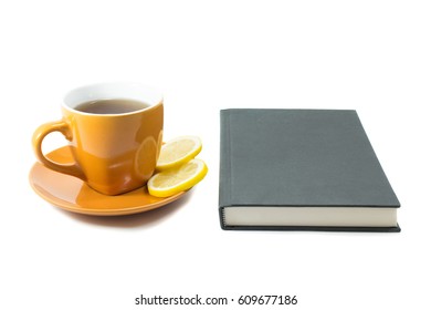 Notebook and cup of tea with lemons