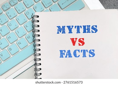 Notebook displaying “Myths vs Facts” text, representing comparison, critical thinking, and distinguishing misinformation from truth in education or business.