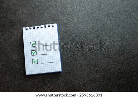 Notebook with an empty, abstract checklist of positive things to do. Business, life, daily planning