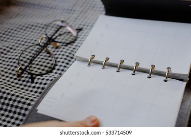 notebook and eyeglasses
