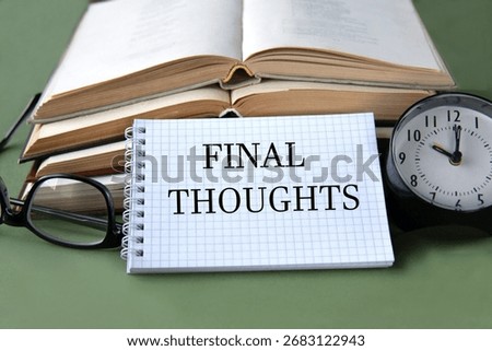 Notebook with FINAL THOUGHTS text on the background of books and alarm clock