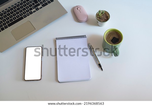 notebook, keyboard, flower, coffee\
and pen.\
New year idea concept.Free space for text in notebook,\
top view, planning concept, business finance goal setting\
concept.