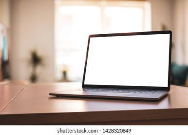 Notebook Laptop With Blank Screen On Table In Living Room - Angled Position