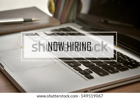 Notebook and Laptop with text NOW HIRING