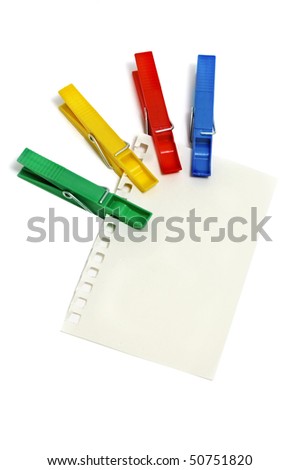 a notebook leaf with some clothespins isolated on a white background