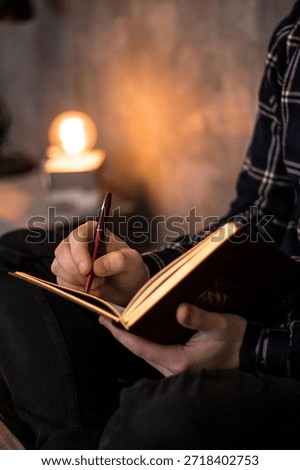 A notebook in a man's hands