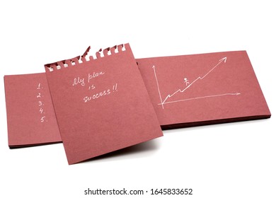notebook with a motivational inscription mine is success and in numbers one two three on a white background. motivation, business, success, design