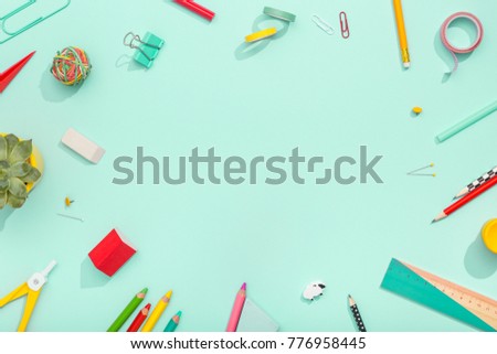 notebook, note, pen, paper clip, on pastel green background. Office desk with copy space. Flat lay.
