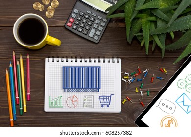Notebook with a notes barcode product on the office table with tools. Concept with elements of infographics.