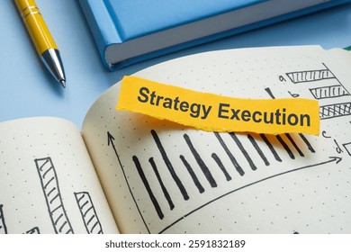 Notebook with notes and the phrase strategy execution. Business planning and goal achievement.