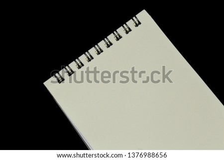 Notebook on the background of black.