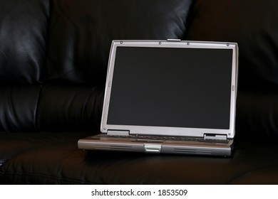 Notebook on a leather couch