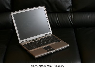 Notebook on a leather couch