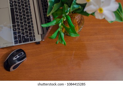 Notebook on the table with flowers