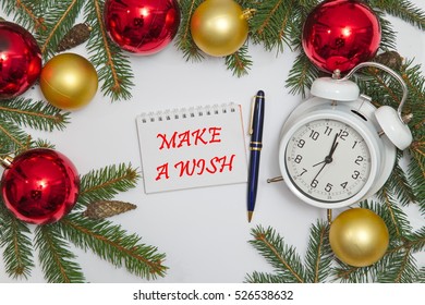 Notebook page with text MAKE A WISH with decoration and old clock, white background
