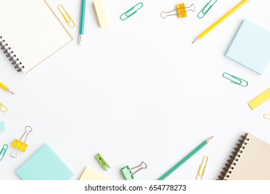 notebook paper, sticky note with pen, paper clip on white background - Powered by Shutterstock