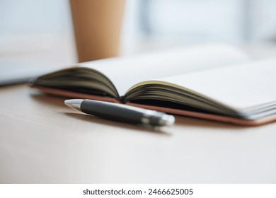 Notebook, pen and coffee for planning, agenda or schedule for interior decoration of minimalist office. Empty, desk and still life with stationery, journal and cup for calendar or productivity - Powered by Shutterstock