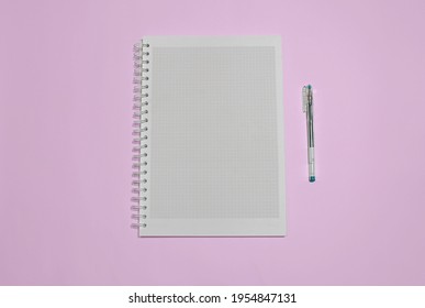 Notebook And Pen On Pink Solid Background.