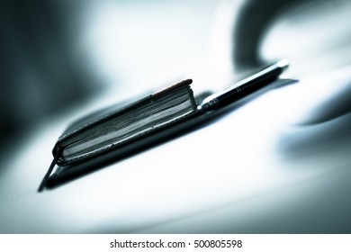 notebook with pen on the table