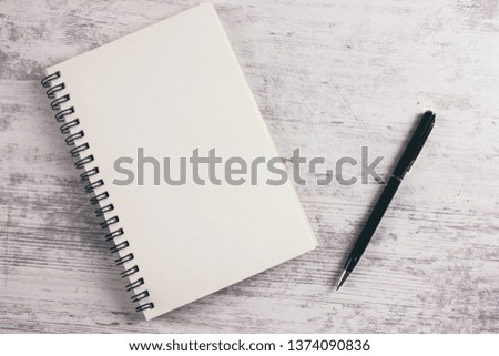 notebook and pen on the table 