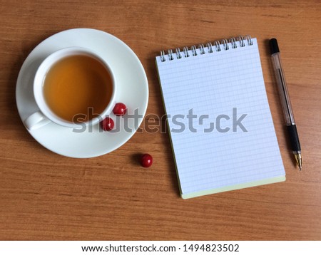 Notebook with pen on the table.