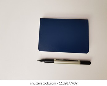 notebook and pen on white background