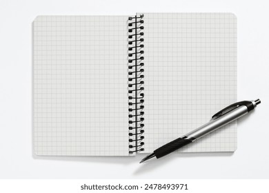 Notebook with pen on a white background. View from above