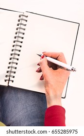 notebook, pen, pencil, write, draw, paint, woman, woman hand, hand, withe sheets, top view, wrist, arms, lady,blond woman, colorful, red nail polish, diary, notes, idea, concept, 