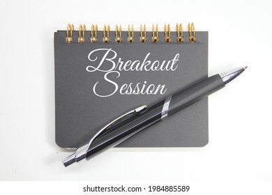 Notebook And Pen With The Word Breakout Session