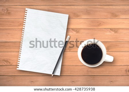 notebook and pencil on rustic table from above, cozy and sweet breakfast, good morning or have a nice day concept