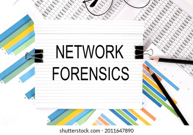 Notebook With Pencils, Glasses On The Graph Background, With Text NETWORK FORENSICS