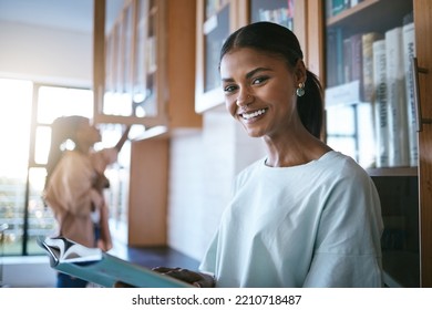 Notebook, Reading And Portrait Of Student In The Library At University. Studying, Education And Young Girl From India At College With Textbook. Learning, Knowledge And Study In Quiet Space With Books