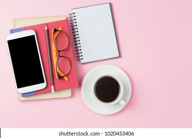 Notebook Red Cover Mobile Phone Calculator And Black Coffee White Cup Orange Glasses On Pink Background Pastel Style With Copyspace Flatlay