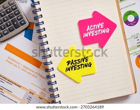 Notebook showing active versus passive investing strategy, with financial documents and calculator