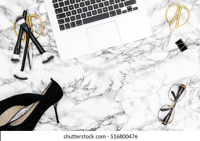 Notebook, supplies, feminine accessories on marble office desk background. Fashion flat lay for blogger social media