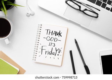 Notebook with Thank God it's Friday text on it. Top view, Friday motivation concept.