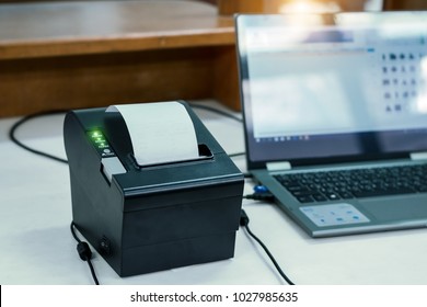 Notebook With Thermal Receipt Printer At Counter Service.For Mockup And Advertising.The Concept Of Trading Business.Receipts And Invoices