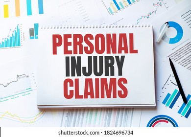 Notebook With Tools And Notes With Text Personal Injury Claims