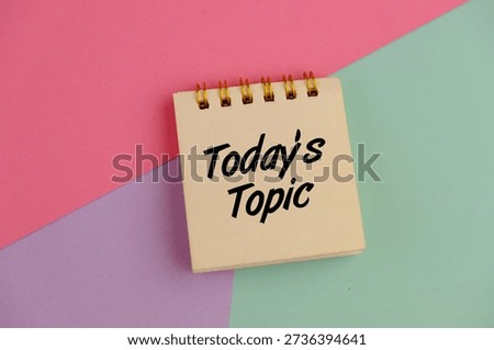 notebook with today’s topic words on pink, green and purple background