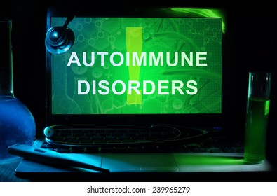 Notebook with words autoimmune disorders , test tubes and stethoscope