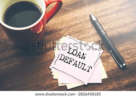 Notebook with the words LOAN DEFAULT 