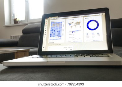 Notebook work with statistics on sofa business