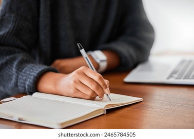 Notebook, writing and hand in home for entrepreneurship, small business and research with laptop. Female person, technology and journal in house for online research, remote work and meeting agenda