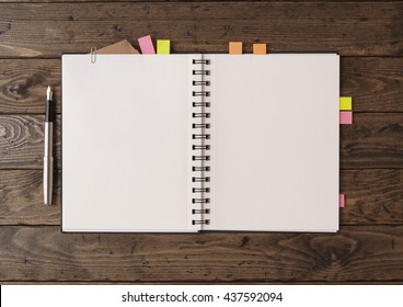 Notebooks and sketch books - A writers / artists journal open on a blank page with book markers and fountain pen, on a rustic wooden desk top to form a revision themed background