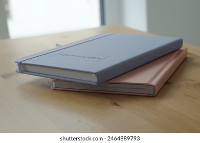 notebooks with text 'think positive' on wooden table. High quality photo