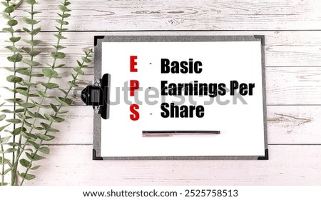 Notepad with the acronym EPS and its full form a Earnings Per Share written on a white sheet . 