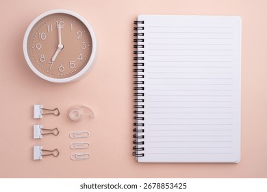Notepad, clips, paper clips and sticky notes, pencils and markers on a colored background. Office or school supplies.
