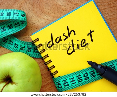 Notepad with dash diet, apple and measure tape